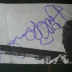 Ariel Bender's autograph on Brian May's hair